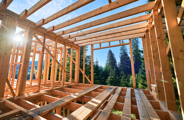 Wooden framework in place for deck framing in residential construction using best decking material.