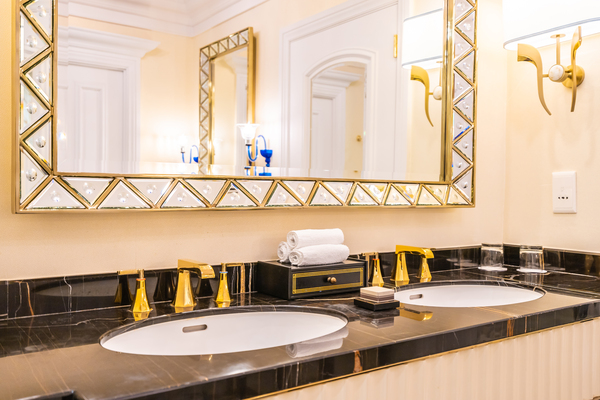 Luxury Double Sink Vanity With Gold Fixtures : Modern luxury bathroom vanities featuring black marble countertop, gold fixtures, and a double sink vanity design