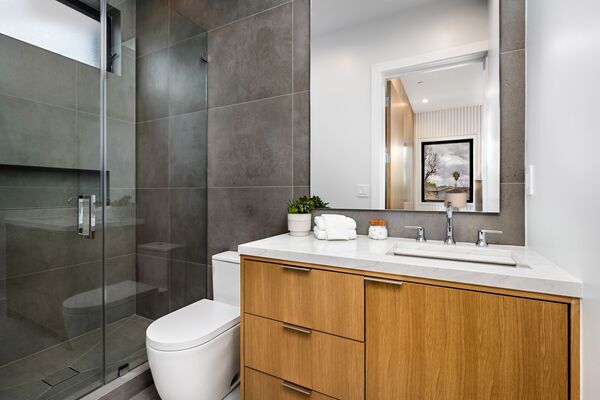 Contemporary Bathroom With Wooden Floating Vanity Minimalist bathroom vanity with sink and modern design featuring floating vanity and wall-mounted mirror