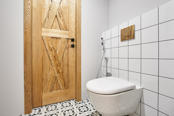 Wall-mounted toilet with ADA bathroom accessory heights