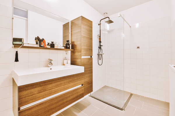 Stylish bathroom interior design bathroom remodel ideas 2022 featuring a modern shower, floating vanity, and wood cabinets