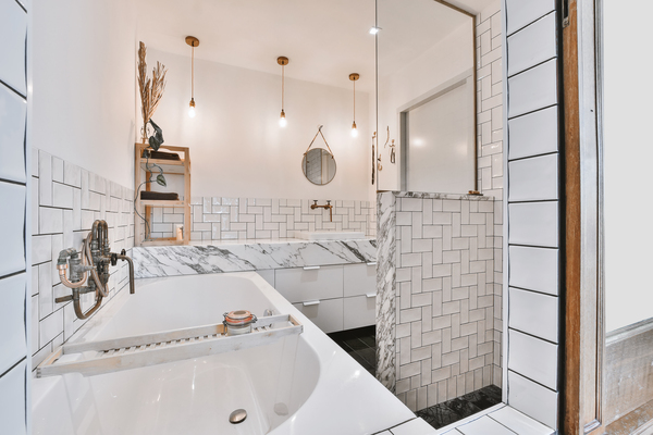 Elegant bathroom interior with marble finishes and pendant lighting, showcasing design ideas supported by bathroom remodel home equity loan heloc financing.