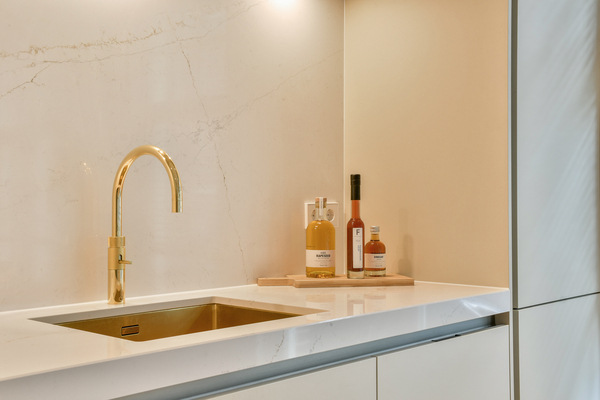 Modern kitchen design luxury with gold faucet and countertop upgrades