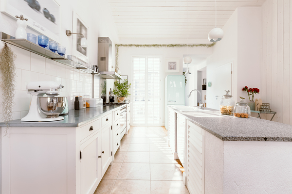 Bright white open-plan kitchen interior styled with modern cabinets and appliances, inspired by home depot lowes ikea home improvement trends.