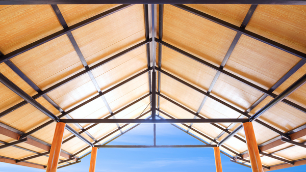 Ceiling with wood PVC plastic composite panels and metal framing showcasing modern roof types