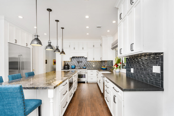 new kitchen gallery luxury kitchen with marble counters and blue accent chairs Marble countertop kitchen with blue chairs featured in new kitchen gallery showcase