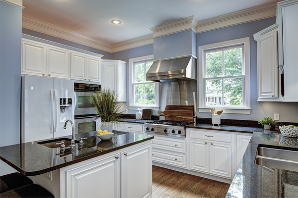 remodeled kitchens photos American-style kitchen with granite countertops and stainless steel appliances Spacious kitchen with granite island and stainless appliances from remodeled kitchens photos collection