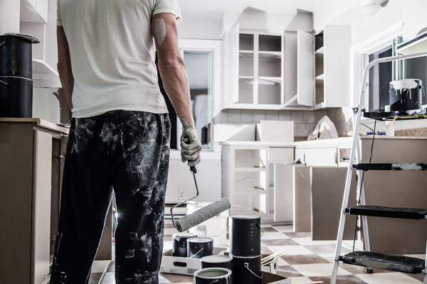 repairs house during kitchen renovation – find a contractor online for interior updates Painter applying fresh coat during repairs house project, highlighting benefits when you find a contractor online for your remodel