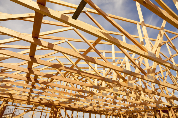 Wooden truss design used in house roof framing showcasing different types of trusses